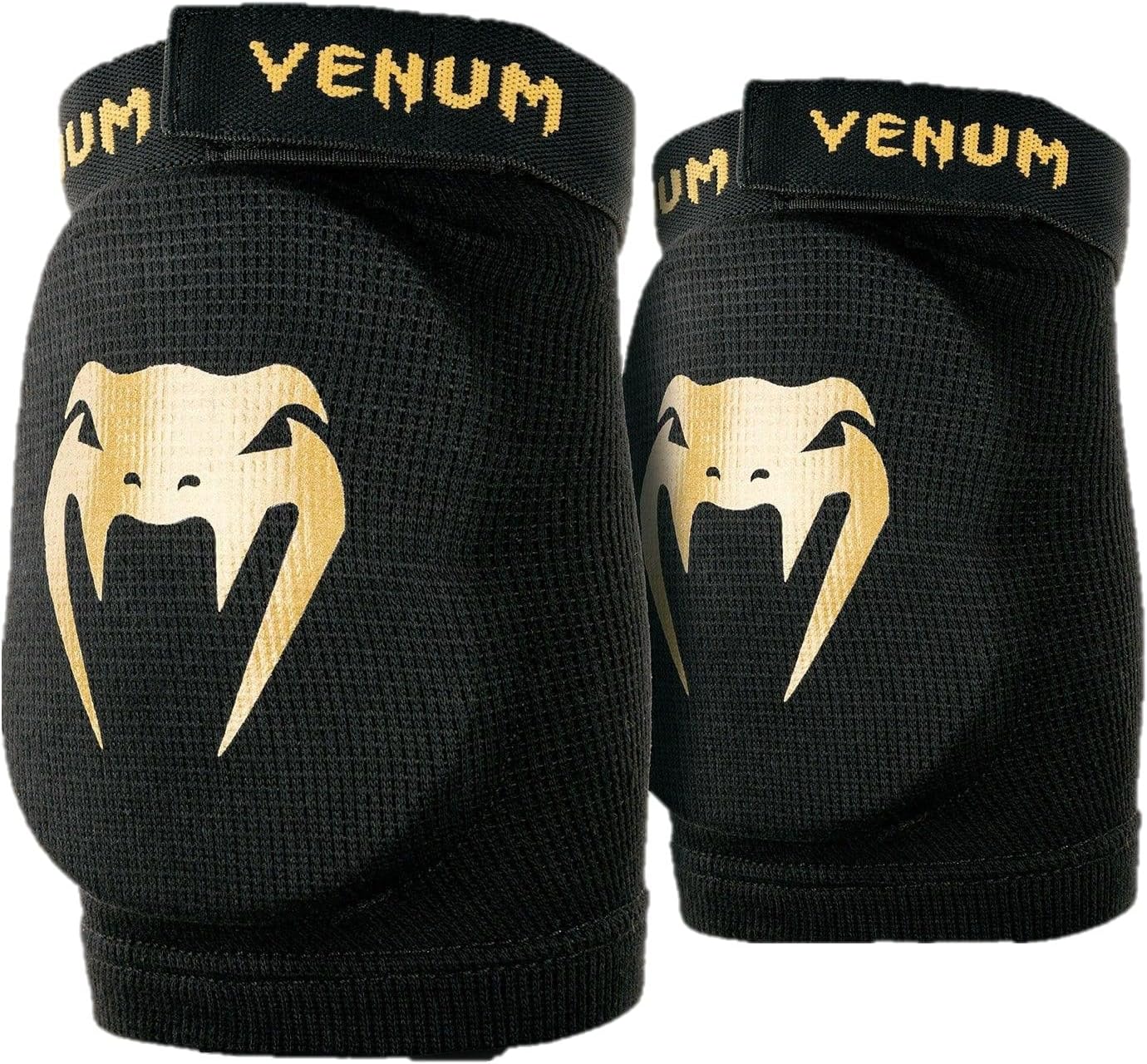 Venum Kontact elbow protector on a training mat
